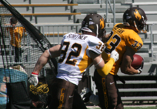 Jake Schiffner chases down Dominic Rufran during the 2012 Brown and White game in Laramie. Jake Schiffner is now headed to the CFL combine in Edmonton, Alberta. (Photo via Richard Anderson/WyomingSports)