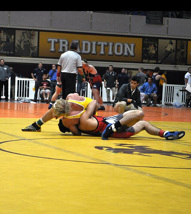 Wyoming's 157 pound junior Andy McCulley goes for a pin recently in the Cowboy Open held in Laramie. (Photo via @WyoWrestle Twitter)