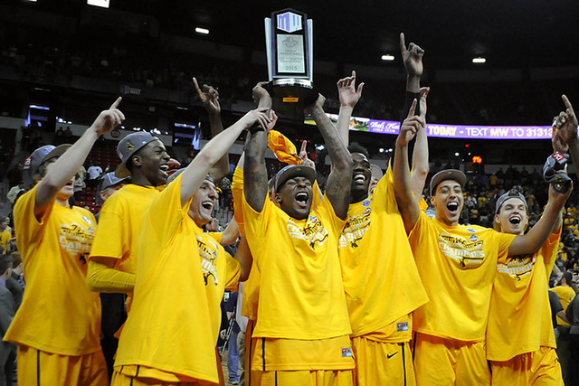 The Cowboys celebrate their Mountain West tournament championship by raising the trophy in front of a large Wyoming crowd. The Pokes will face Northern Iowa in Seattle on Friday morning. (Sam Morris/Las Vegas Review-Journal)