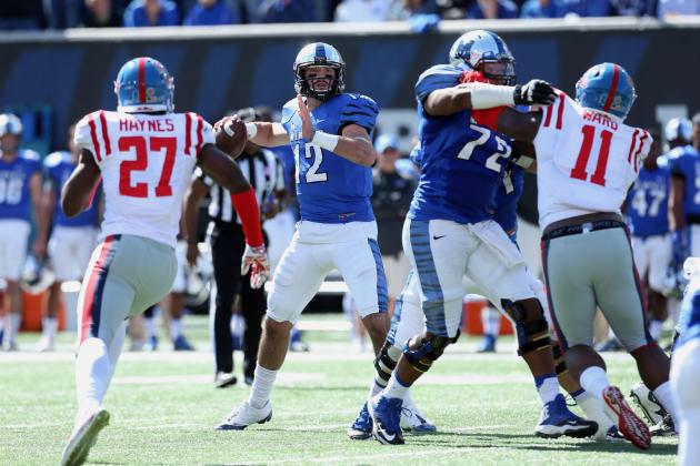 Memphis quarterback Paxton Lynch drops back to pass vs Ole Miss this past weekend. The Tigers went on to win that game against the Rebels 37-24. The Tigers, among other team, are building their case to represent the Group of Five in a New Years day bowl game. (Photo via Joe Murphy/Getty Images)