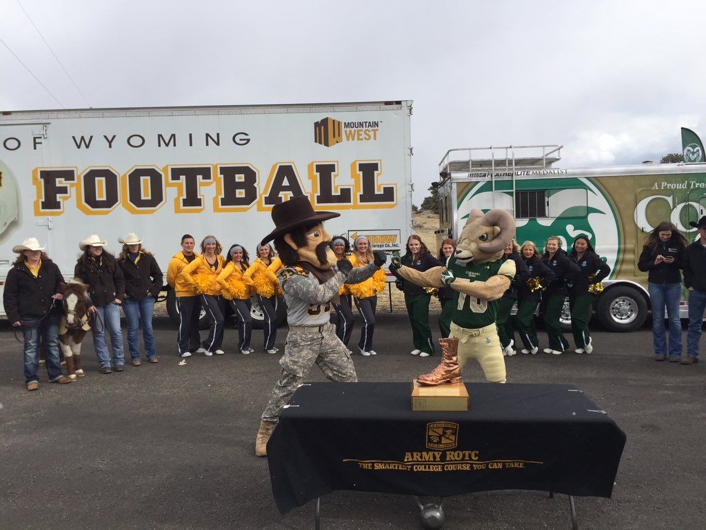Pistol Pete and Cam the Ram meet at the Wyoming/Colorado border on Friday in the annual passing of the game ball at the border. The two teams met on Saturday for the 107th time in history. (Photo via Wyoming Athletics)